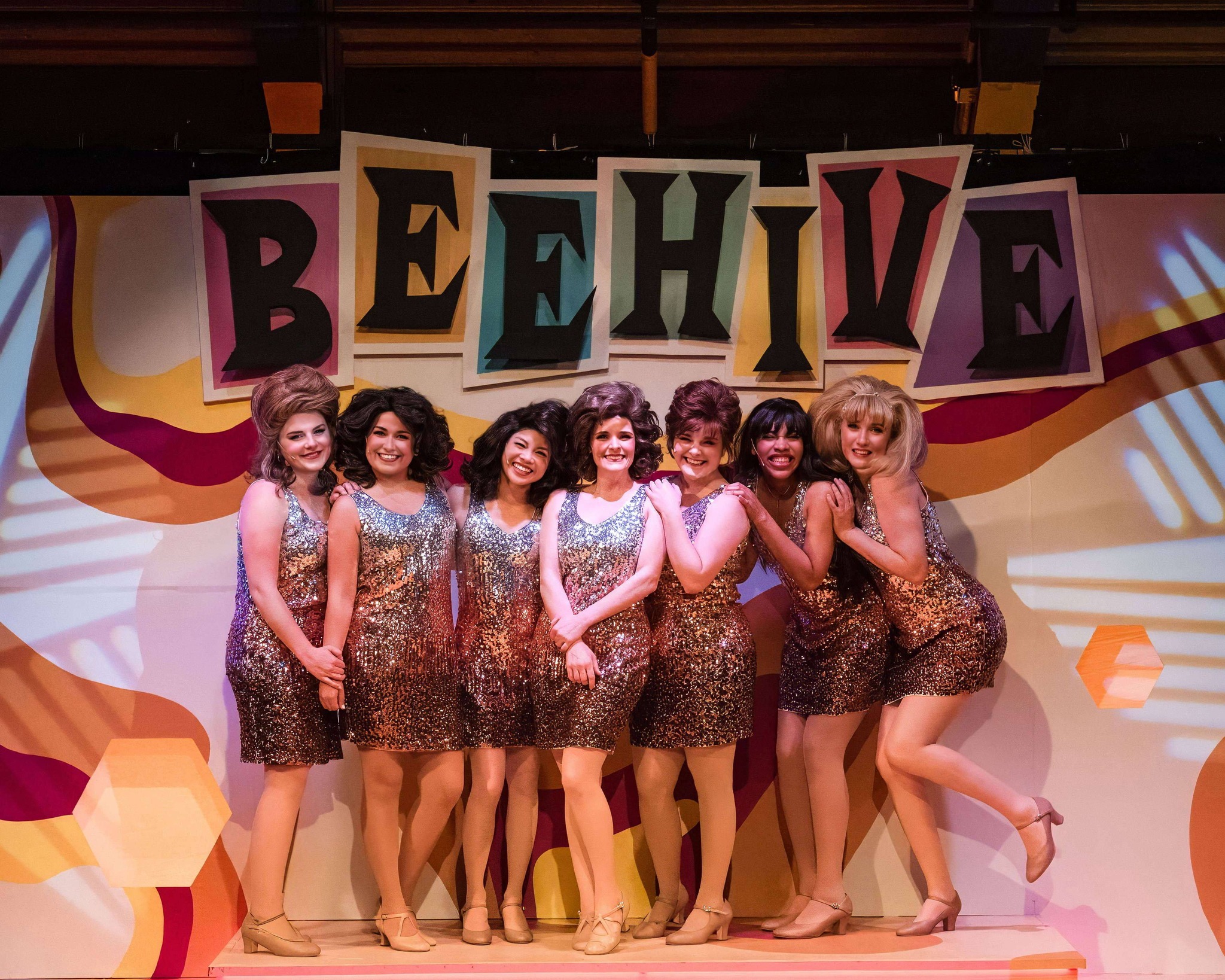 The cast of BEEHIVE - THE 60s MUSICAL in sparkly gold dresses